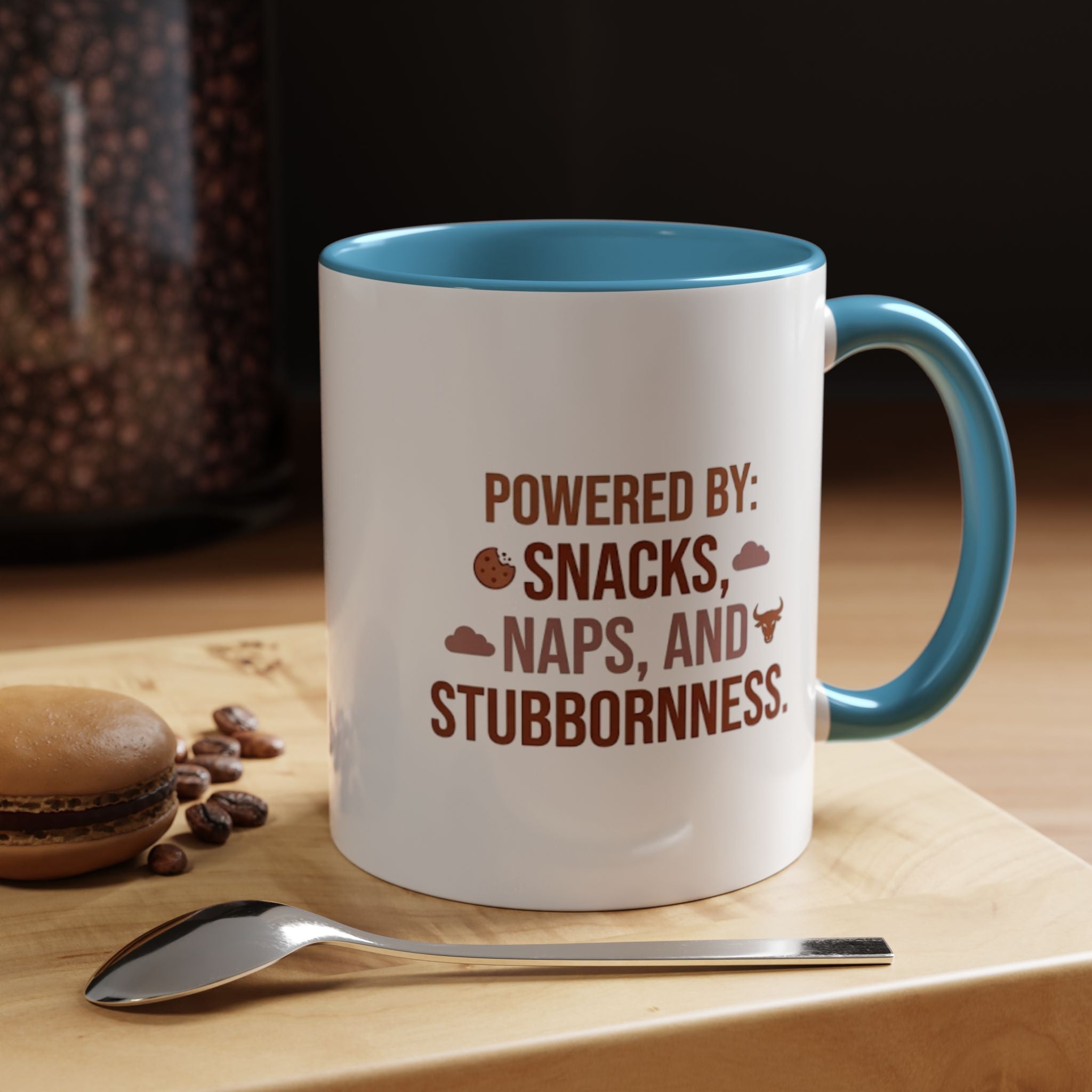 Coffee Mug — "Powered by: Snacks, Naps, and Stubbornness" Ceramic Accent Mug