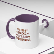 Coffee Mug — "Powered by: Snacks, Naps, and Stubbornness" Ceramic Accent Mug